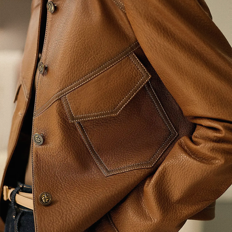 Women's brown leather jacket with collar and front pockets