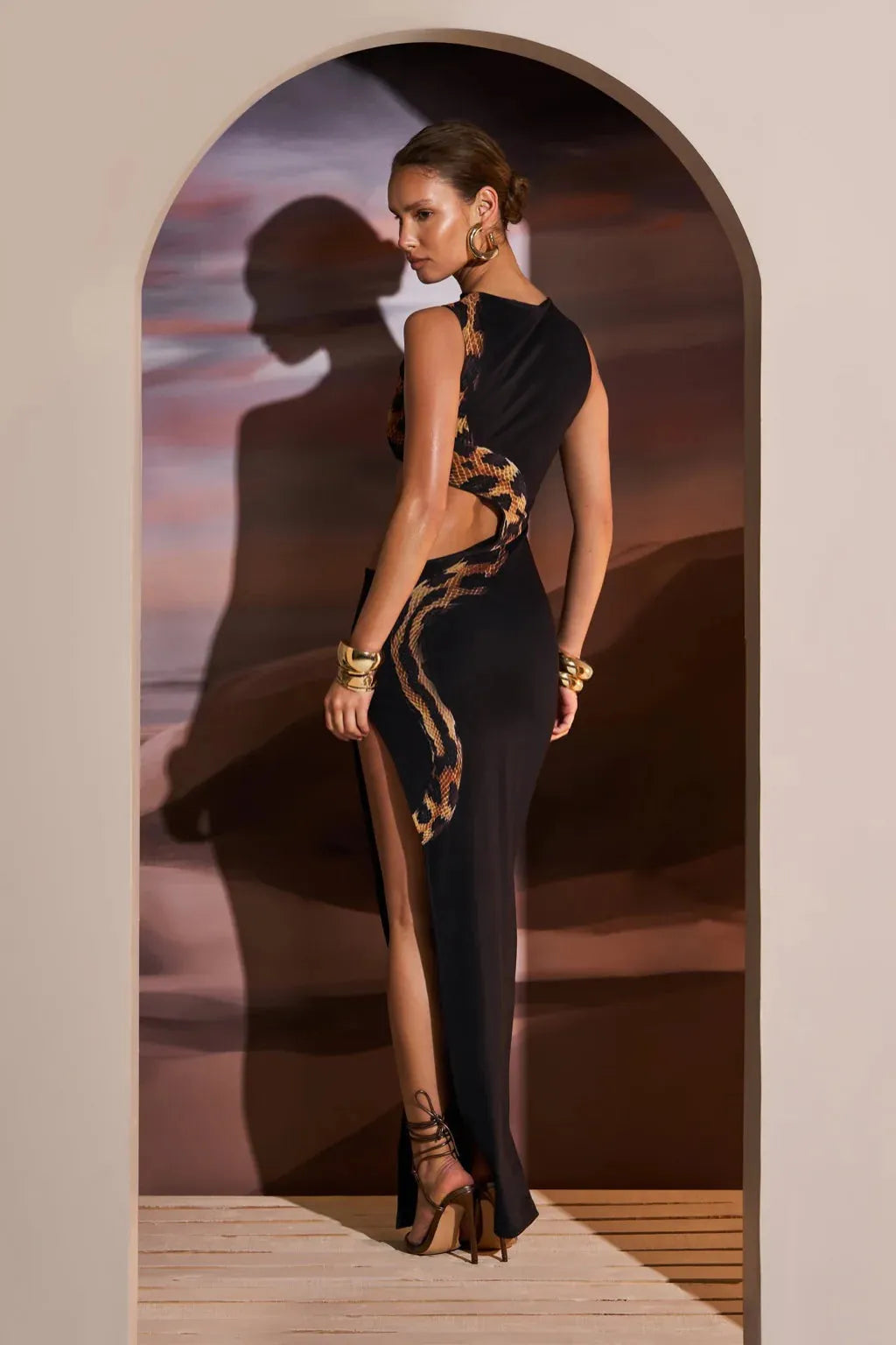 Side angle view of the Black maxi dress highlighting the overall silhouette
