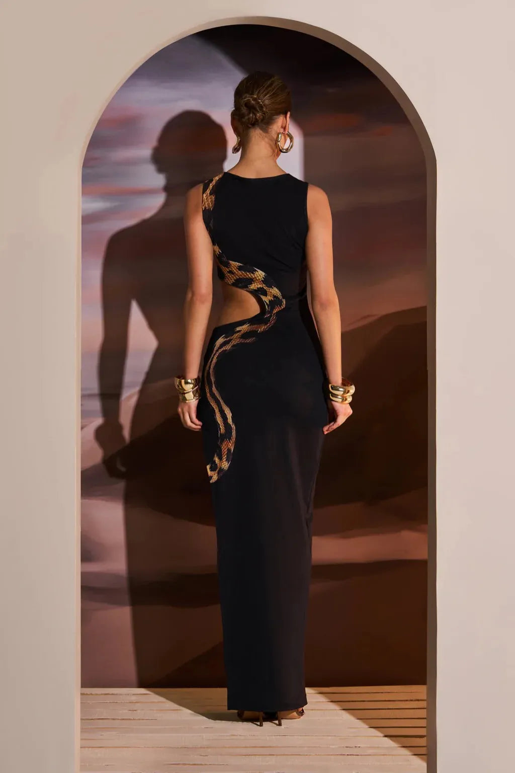 The Black maxi dress photographed from a different angle to show the fit