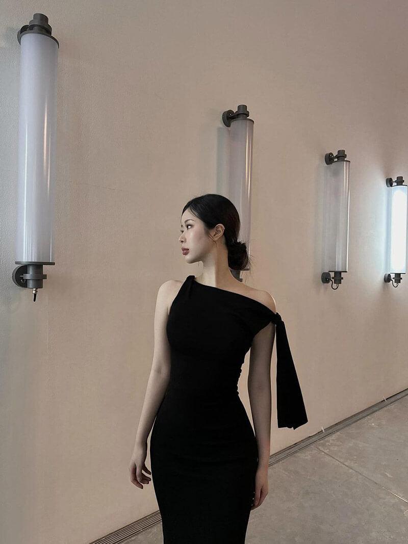 Black one-shoulder bodycon maxi dress, shown from the front
