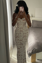 Back view of the white lace maxi dress with delicate adjustable straps