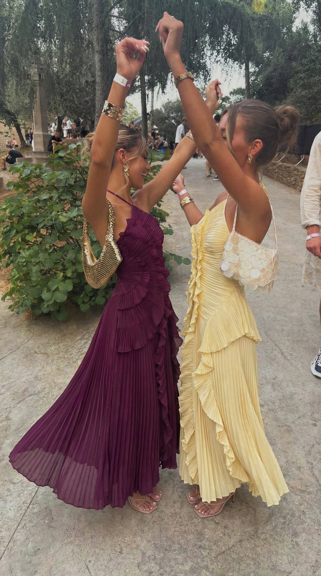Plum and yellow halter maxi dresses styled together for a Spring event