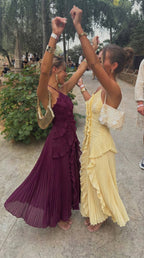 Plum and yellow halter maxi dresses styled together for a Spring event