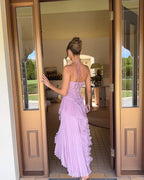 Lavender halter maxi dress, back view walking through open doors