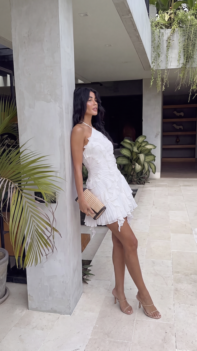 White halter ruffle mini dress with cascading ruffle detailing