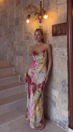 Close-up of the pink floral maxi dress's sheer side-slit inserts.