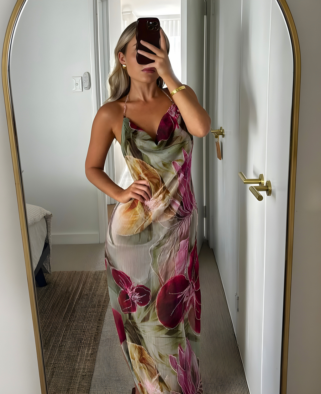 Side view of the pink floral maxi dress with hand-beaded embellishment.