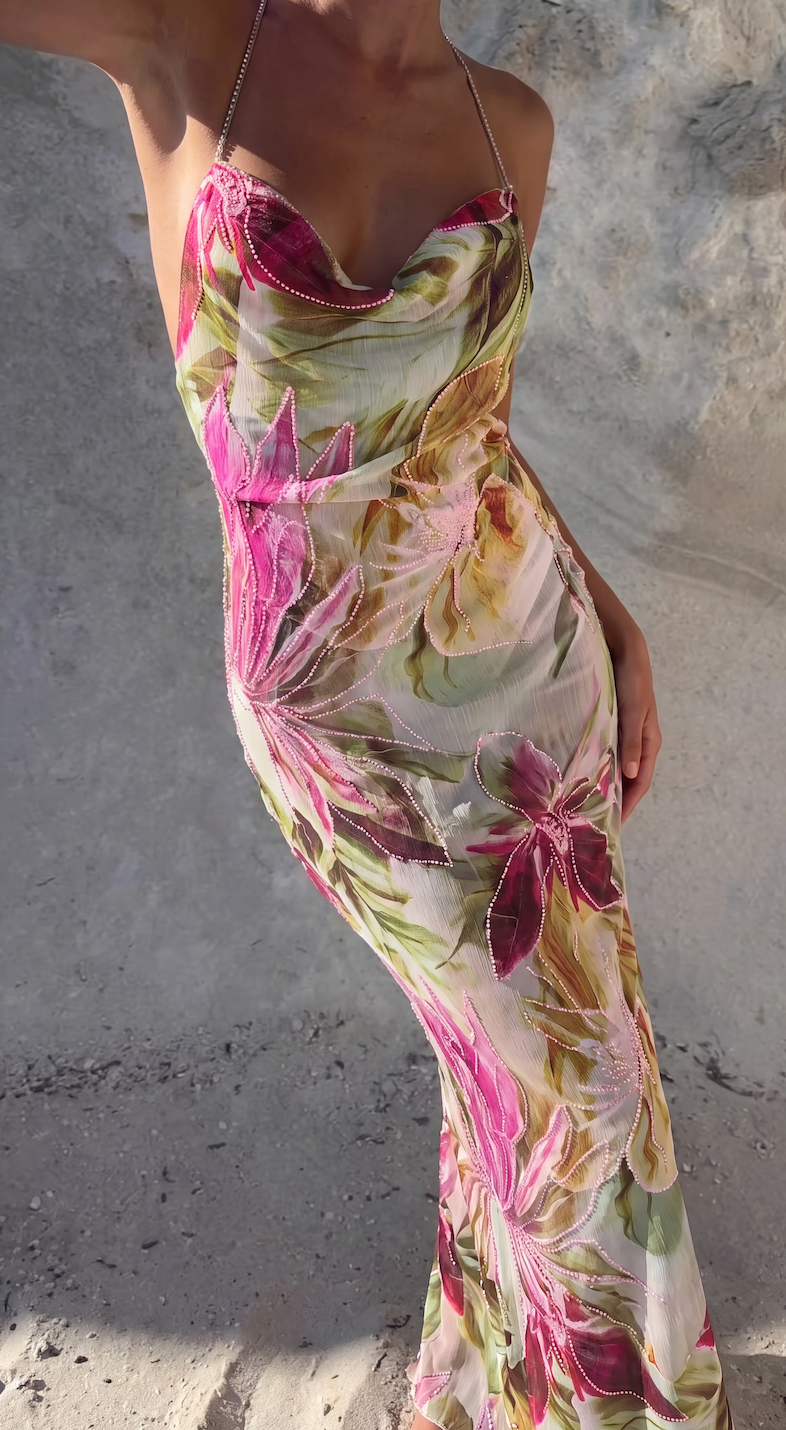 Full-length look at the pink floral maxi dress and its waterfall neckline.