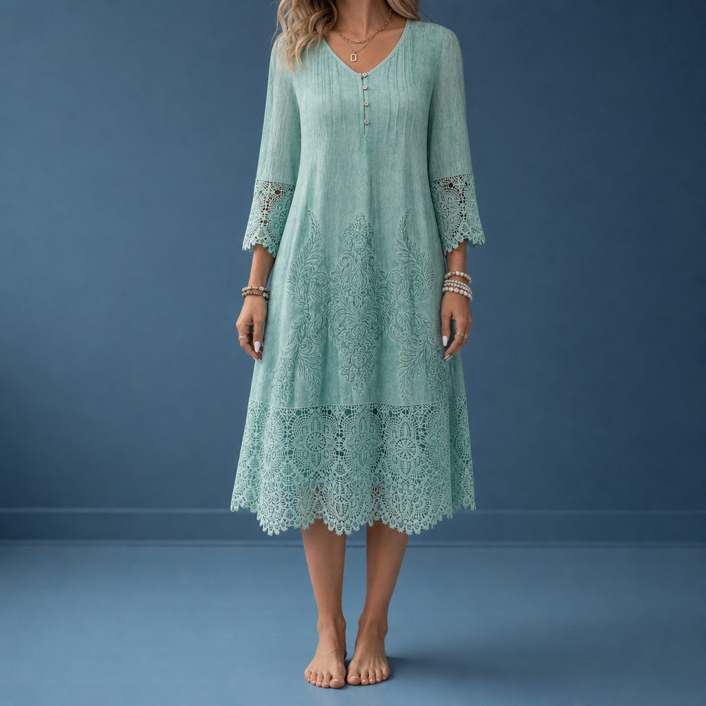 Mint green lace trim midi dress worn against a blue backdrop