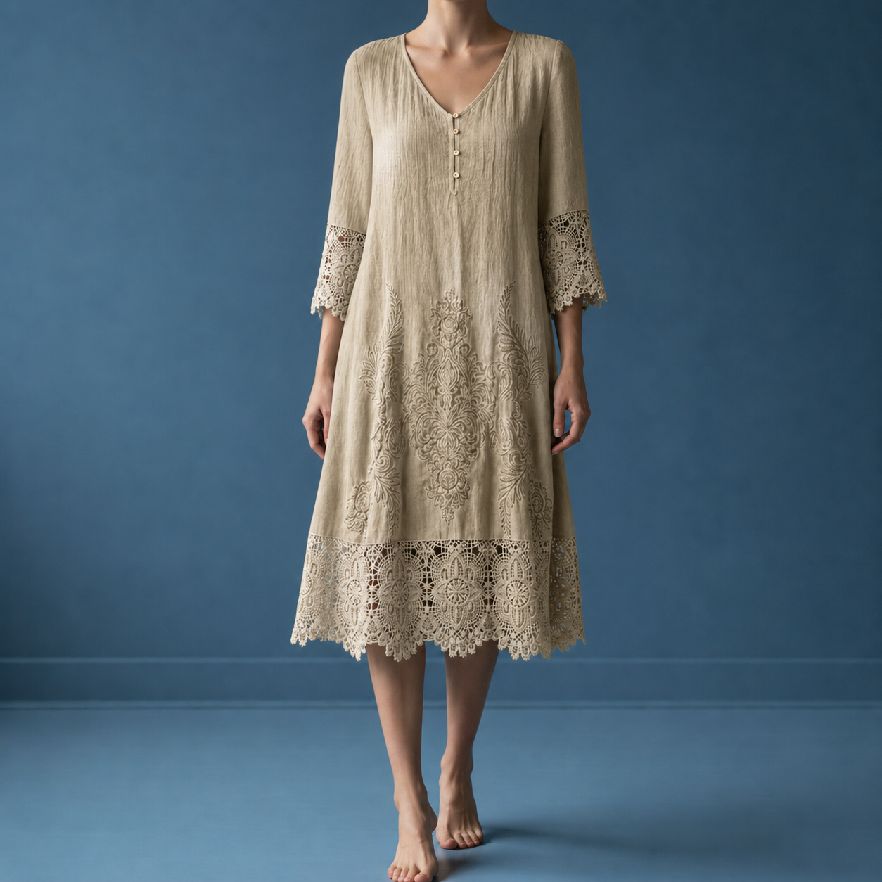 Khaki lace trim midi dress worn against a blue backdrop