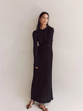 Black ribbed knit maxi dress with a high round neckline