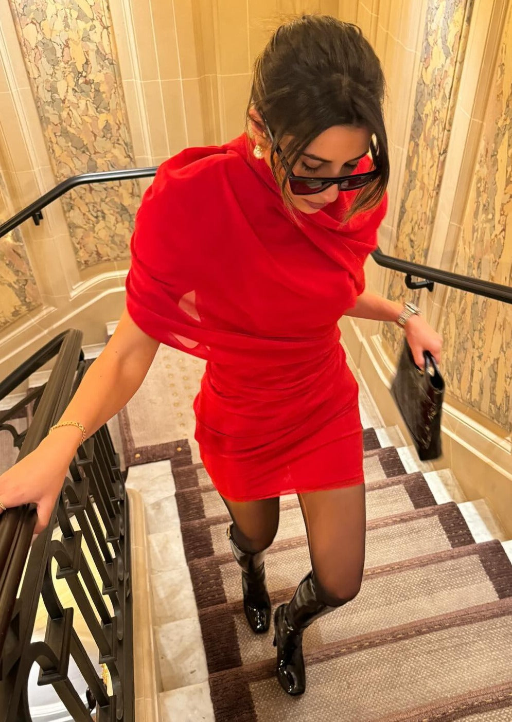 Front view of the red chiffon mini dress featuring draped chiffon overlay.