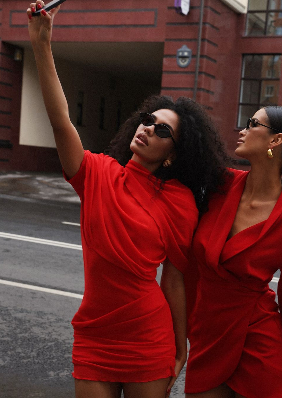 Detail shot of the red chiffon mini dress showing round neckline.