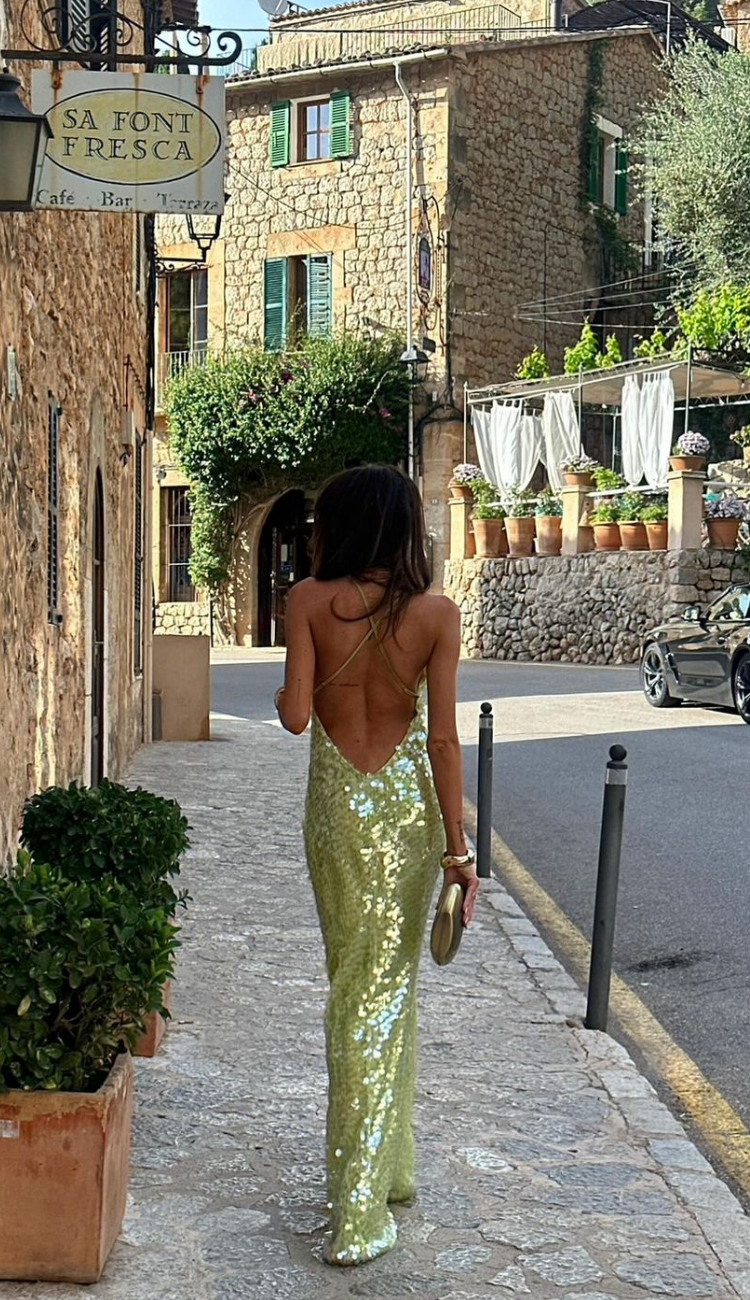 Side angle view of the Green maxi dress highlighting the overall silhouette