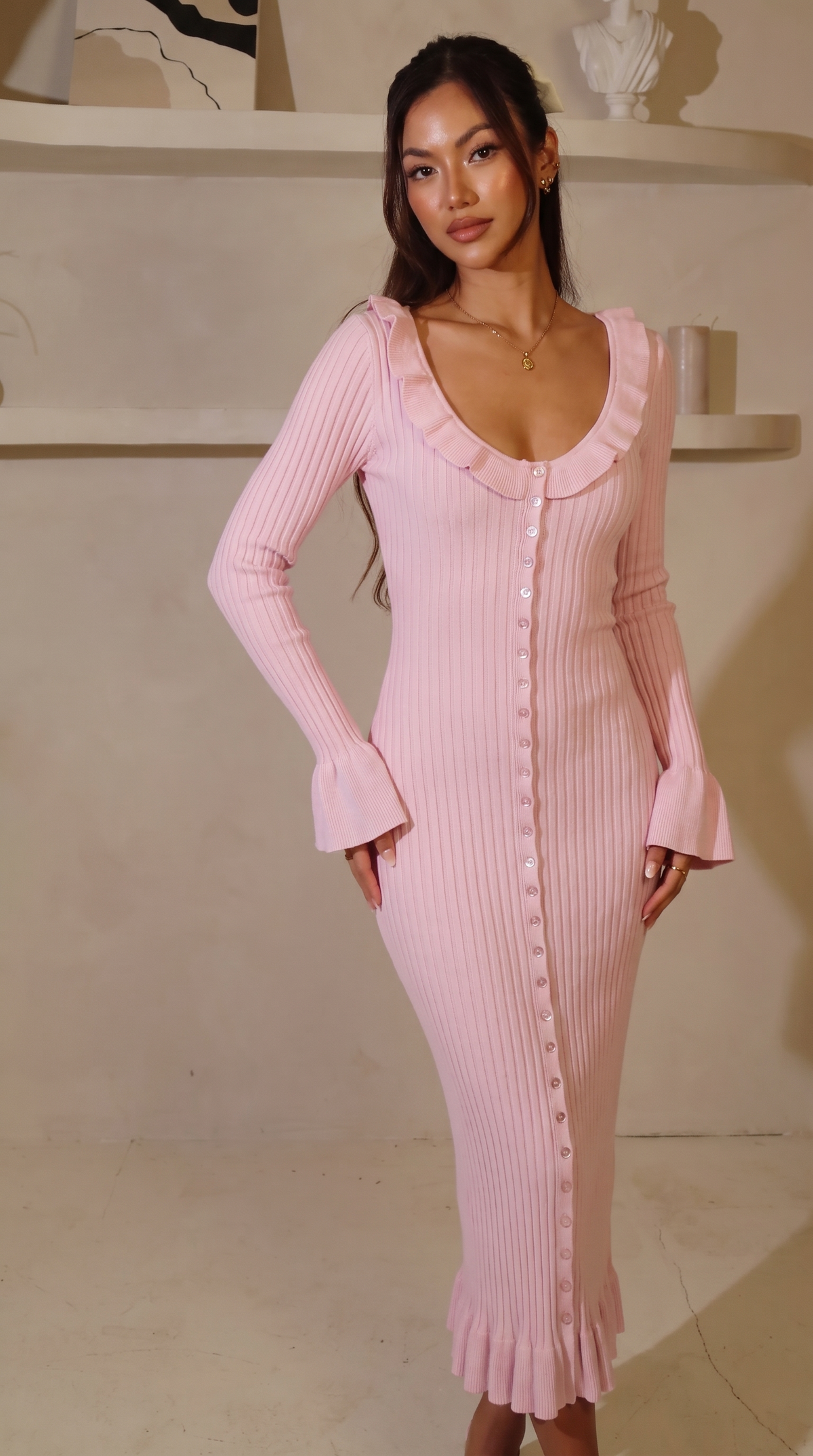 Knit midi dress in Pink, showing the delicate ruffle trim.
