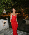 Red off-shoulder maxi dress with a bold backless design