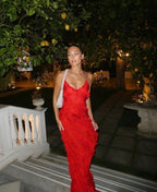 Red off-shoulder maxi dress with a bold backless design