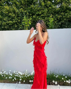 Red off-shoulder maxi dress styled for a wedding or garden party
