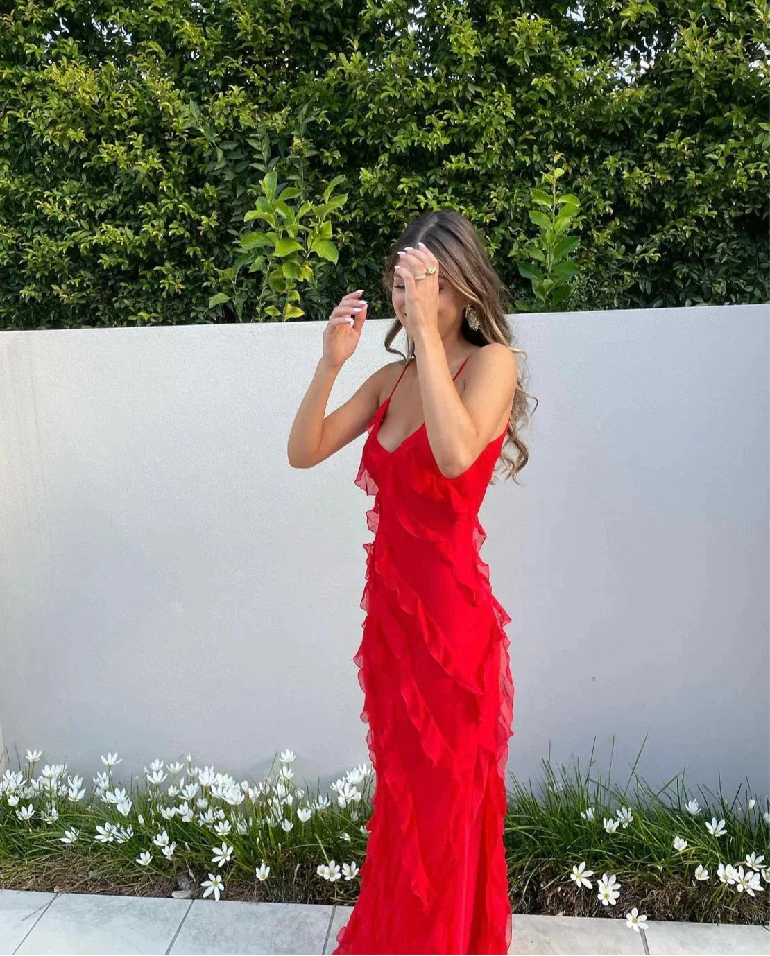 Red off-shoulder maxi dress styled for a wedding or garden party