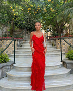 Red off-shoulder maxi dress with a flowing, fluid silhouette