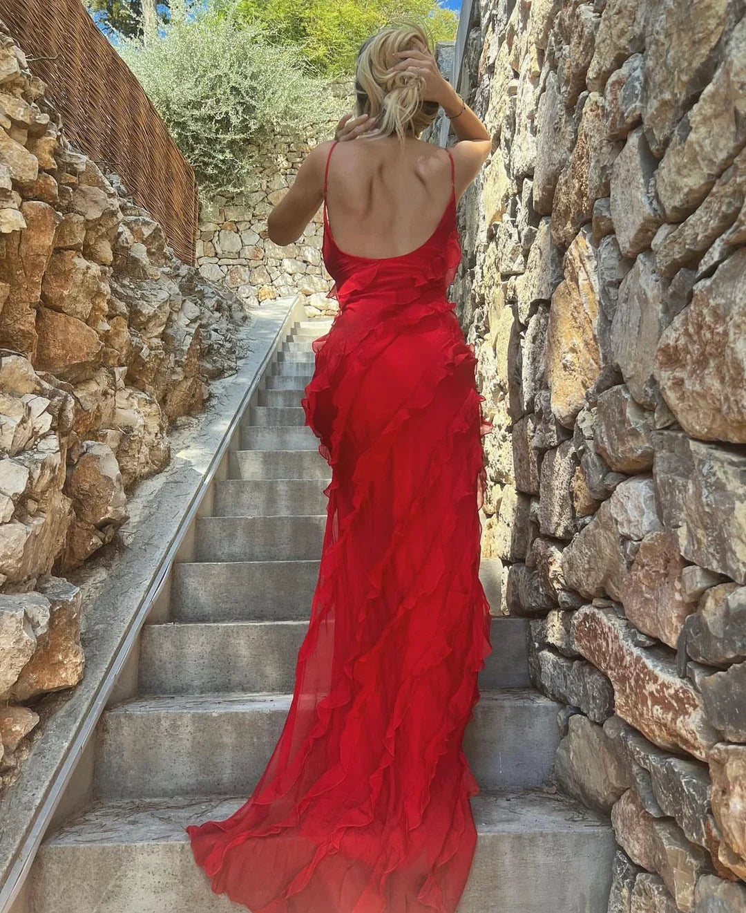 Red off-shoulder maxi dress with a bold backless design
