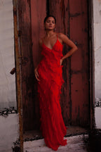 Red off-shoulder maxi dress with a flowing, fluid silhouette
