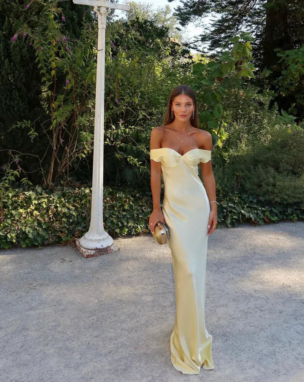 Front view of the champagne satin maxi dress featuring backless design.