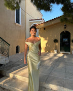 Close-up of the champagne satin maxi dress's lightweight breathable feel.