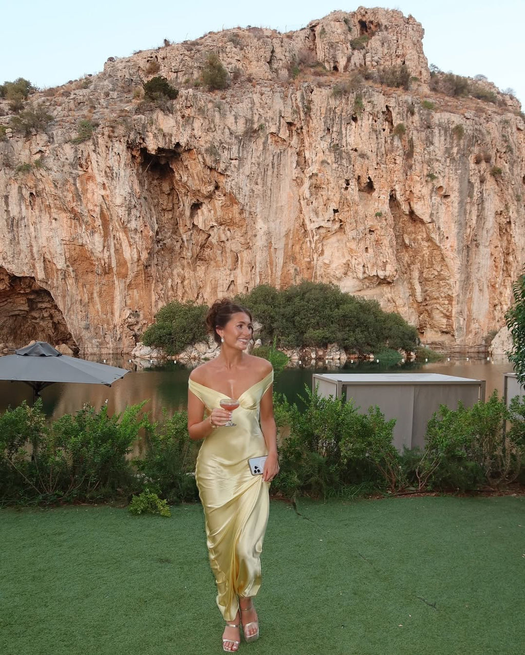 Detail shot of the champagne satin maxi dress showing glossy satin finish.