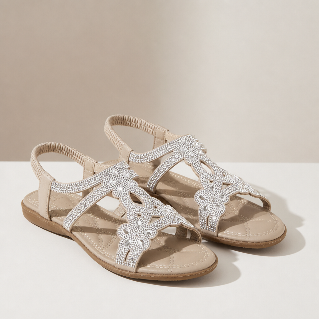 Close-up of the Silver flat sandals showing the fabric texture and finish in detail