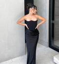 Black corset maxi dress with strapless bodice and front draping