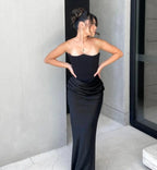 Black corset maxi dress with strapless bodice and front draping