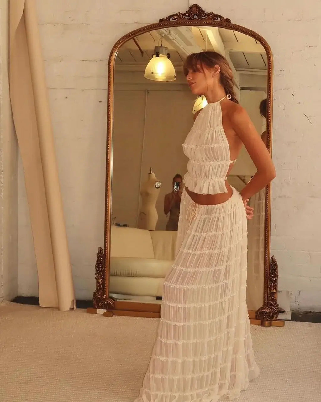 Cream ruffle halter two-piece set reflected in a bedroom mirror