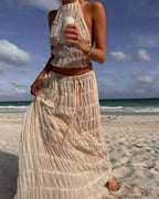 Cream ruffle halter two-piece set, back view on the beach