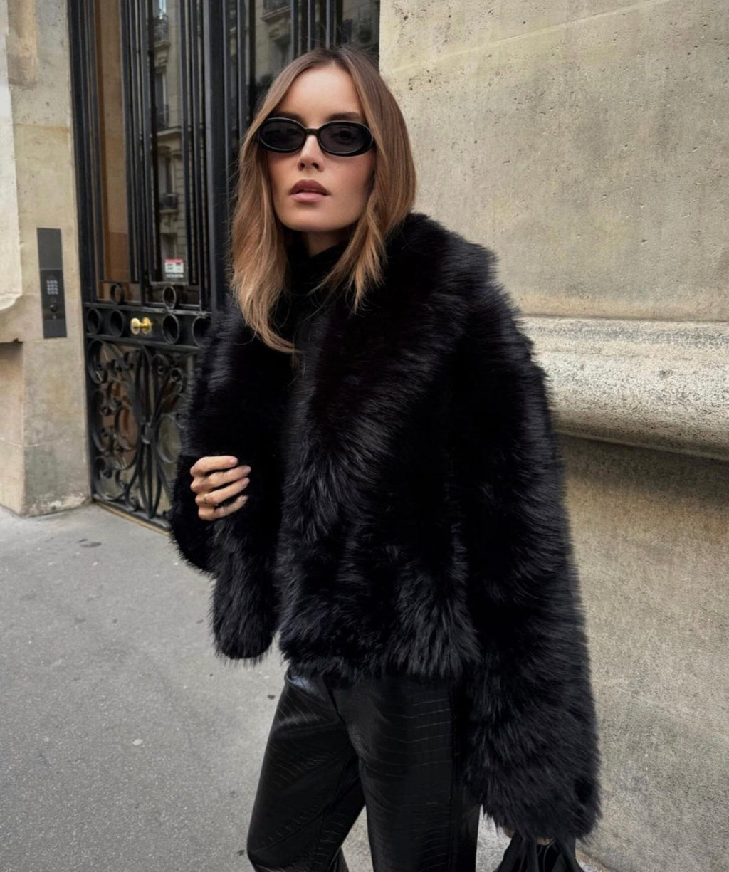 Black faux fur coat with wide lapels, front view