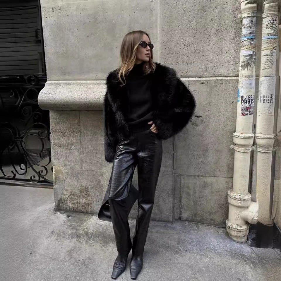 Black faux fur coat close-up of collar and wide lapel