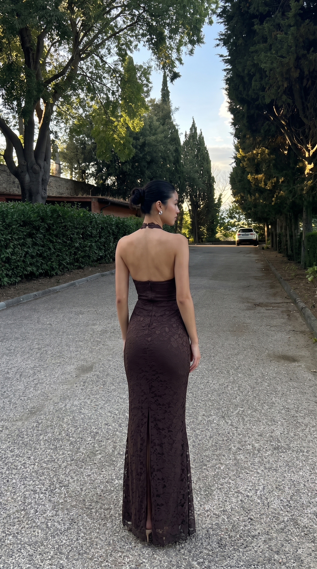 Dark brown maxi dress styled for evening wear, front view