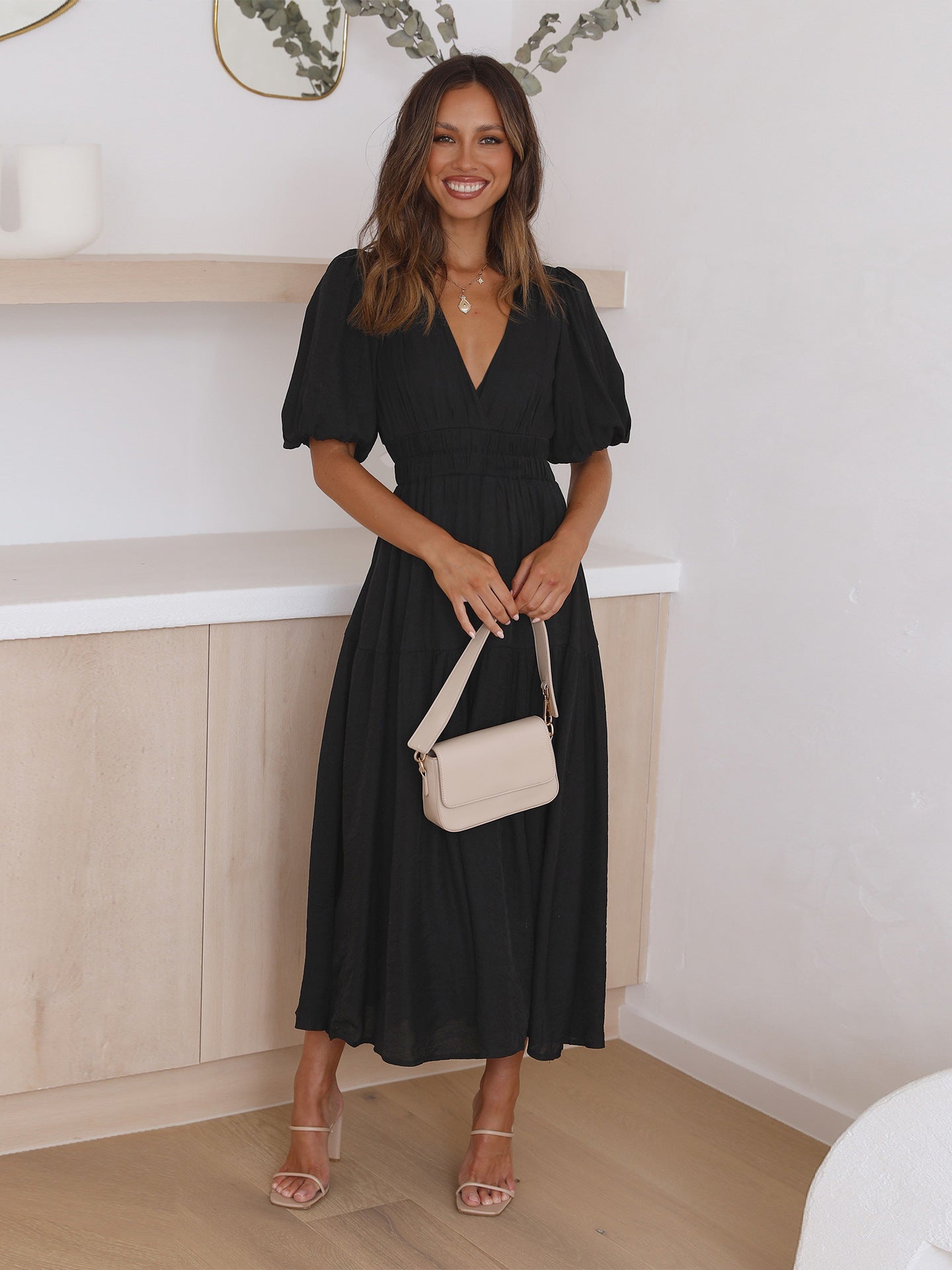 Close-up detail shot of the Black maxi dress showing the design and stitching