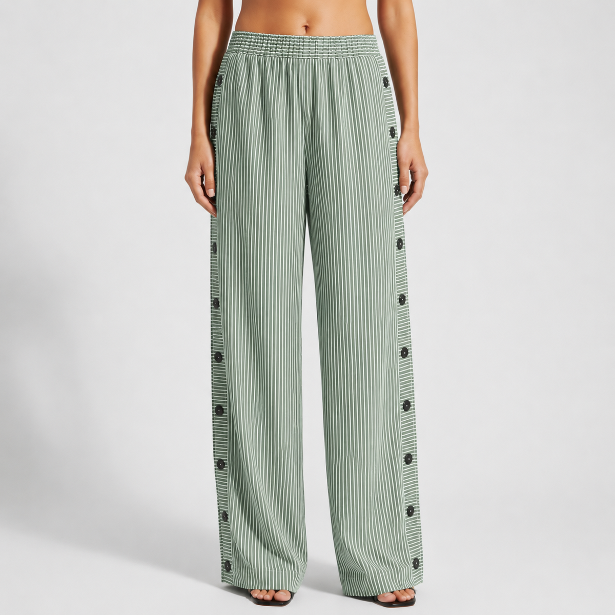 Green striped trousers with button-accent seam detail