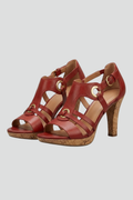 Red heeled sandals with a multi-strap upper, shown from the front