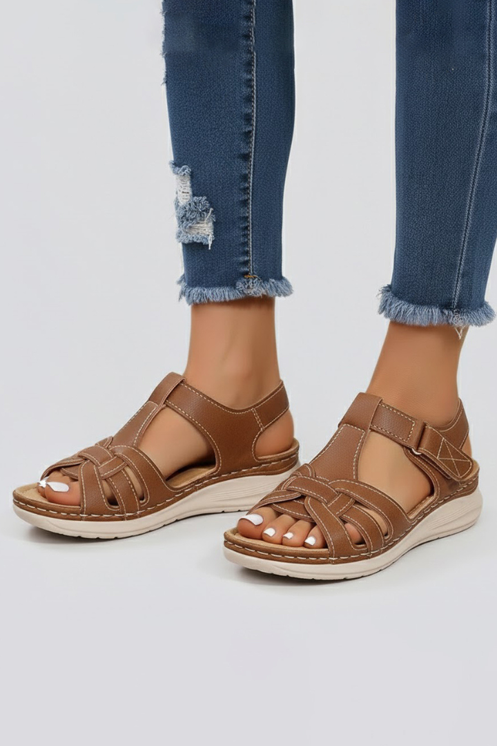 Brown open-toe sandals sole and cushioned footbed view