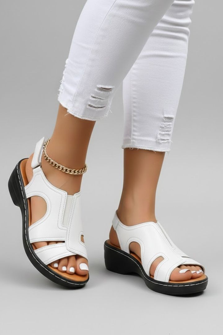 White cutout platform sandals worn with white jeans