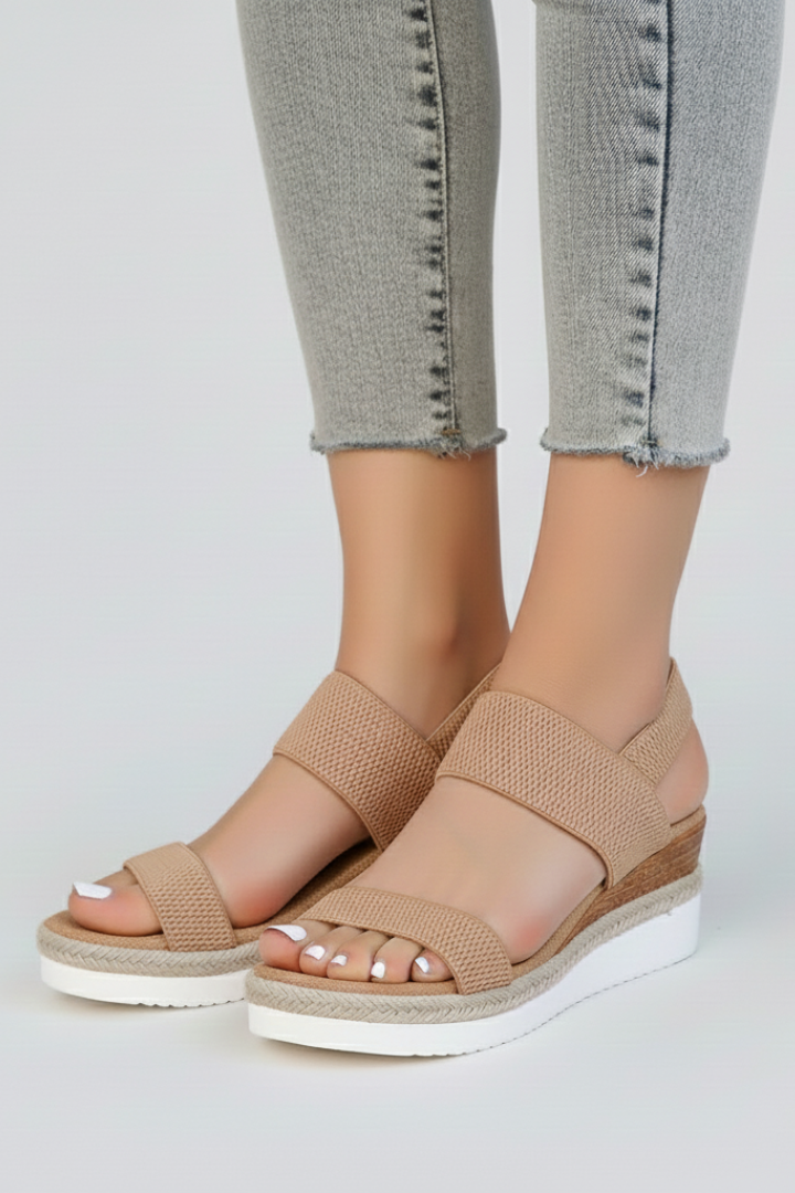 The Blue wedge sandals worn in a lifestyle setting to show how it falls