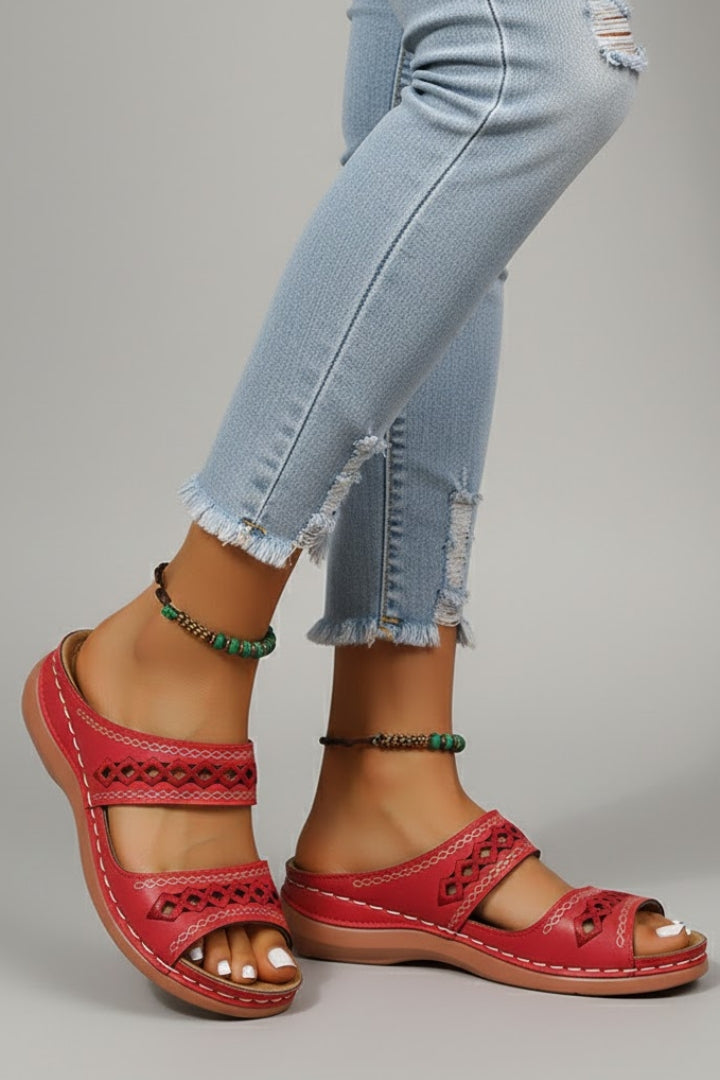 Side angle view of the Black slide sandals highlighting the overall silhouette