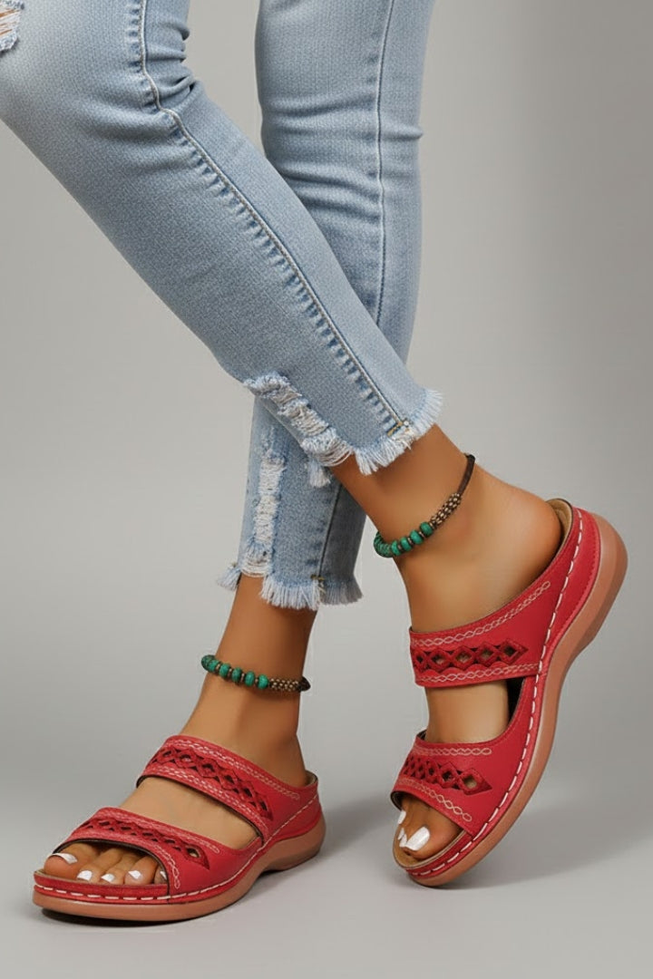The Red slide sandals photographed from a different angle to show the fit