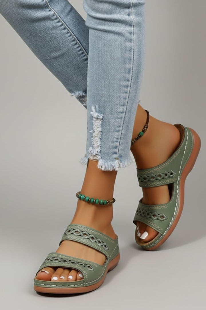 Close-up detail shot of the Blue slide sandals showing the design and stitching
