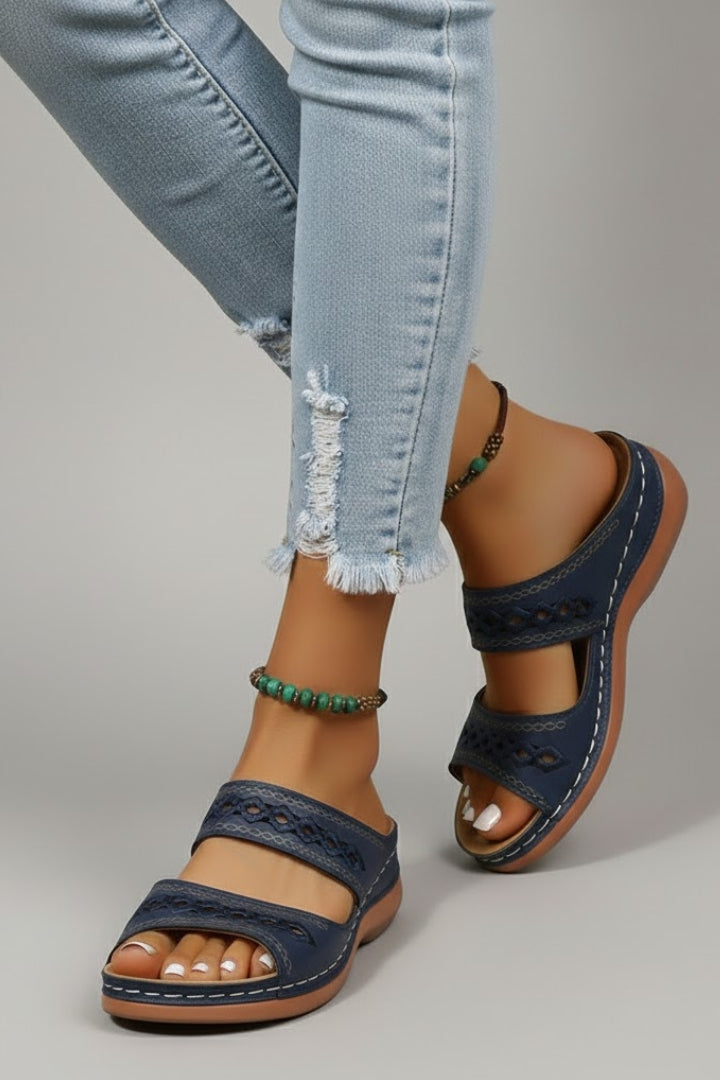 The Black slide sandals worn in a lifestyle setting to show how it falls