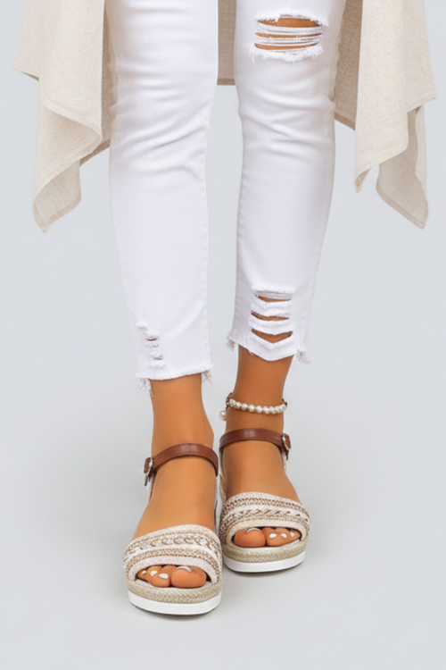 Brown wedge sandals with adjustable ankle straps, front view