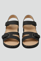 Black wedge sandals with adjustable hook-and-loop straps, product view