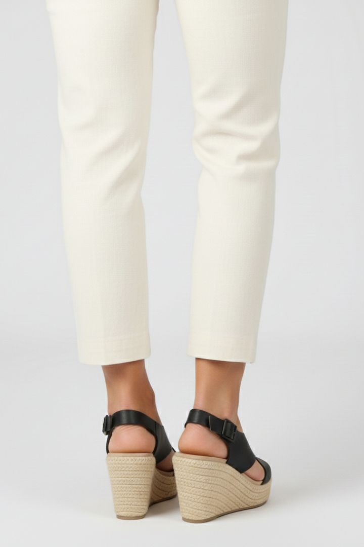 Back view of black espadrille wedge sandals showing slingback buckle